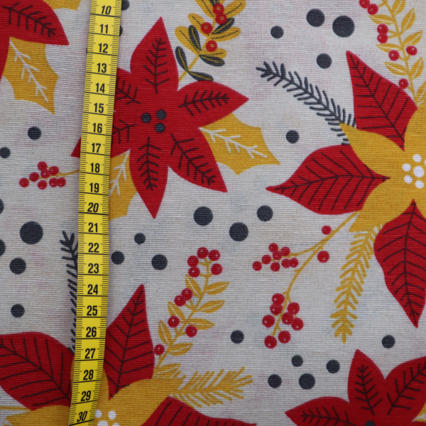 Vianočná dekoračná látka LONETA červeno-žltá vianočná hviezda