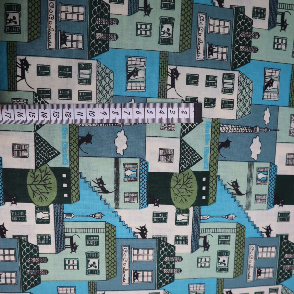 Bavlnená látka domy bledo modré
